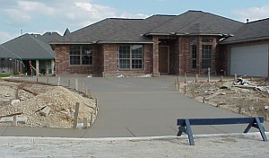 The completed driveway and sidewalk.