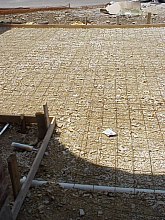 The picture of the driveway above shows the reinforcement that has been added to strengthen the concrete.