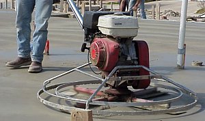 Finally, a power trowel is used to smooth the concrete.