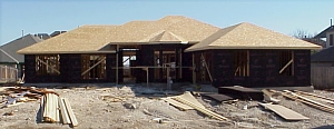 A picture of the front of the house showing the roof decking.