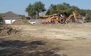 A picture from the back of the lot- pictures from the building of a custom home.