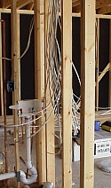 The electrical wires run throughout the house from the garage.