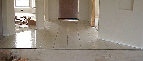 Once the tiles have been set as in the entry above, they must be allowed to dry for at least 24 hours before the grout is applied.